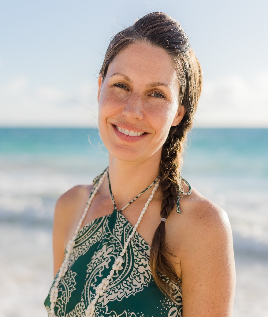 Woman business owner smiling at the beach